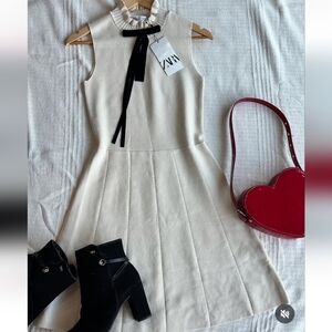 Zara Cream Sleeveless Ruffle-Neck Mini with Black Ribbon